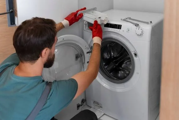 Technician repairing the control area of a front-loading washer