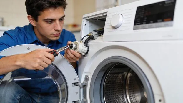 Technician working on washing machine door components
